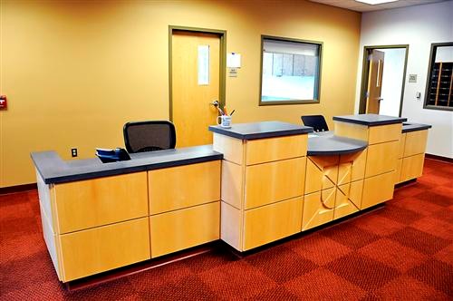Maple Wood Panels with Reveals and Corian Top Administration Desk