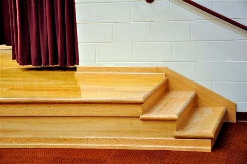 Full Front View of Stage with Bullnose Edging on Stage and Stairs with 4" Wood Base and Vertical Face